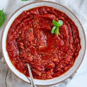 completed Sweet Tomato Chutney in a white bowl against a white background