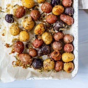 completed Roasted Rosemary Potatoes in a white tray