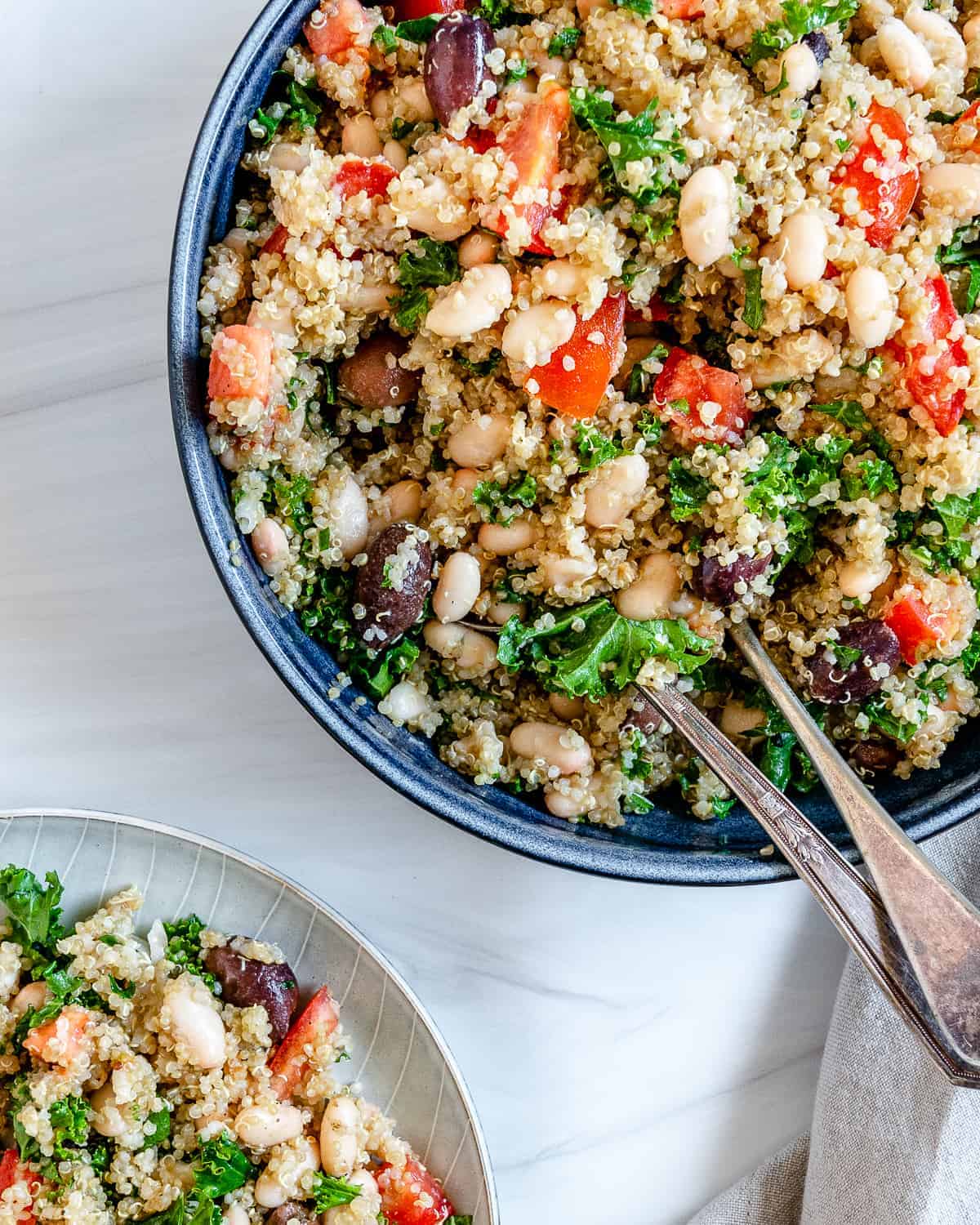 completed Lemon Garlic Quinoa in a blue bowl against a white background