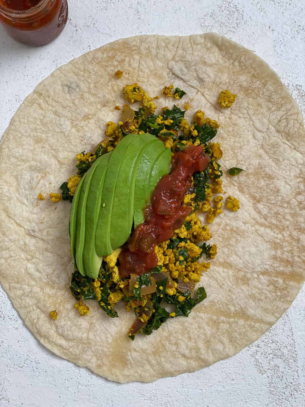 process shot of adding ingredients to tortilla