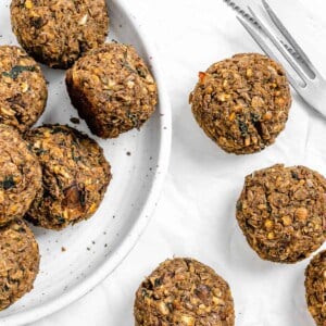 completed Vegan Lentil Meatballs plated and scattered on a white surface