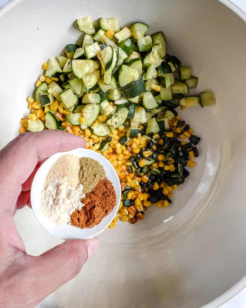 various ingredients in a white bowl against a white background