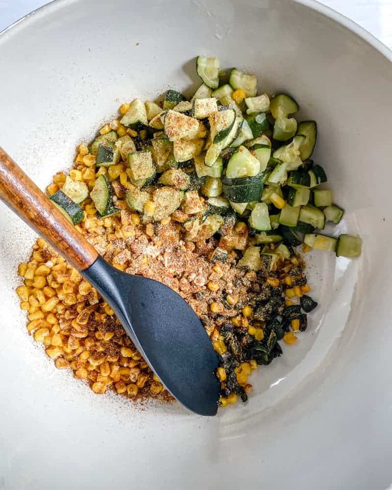 various ingredients in a white bowl against a white background