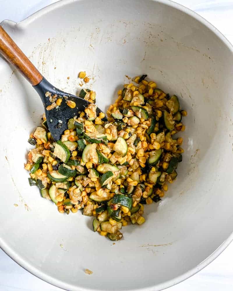 various ingredients in a white bowl against a white background