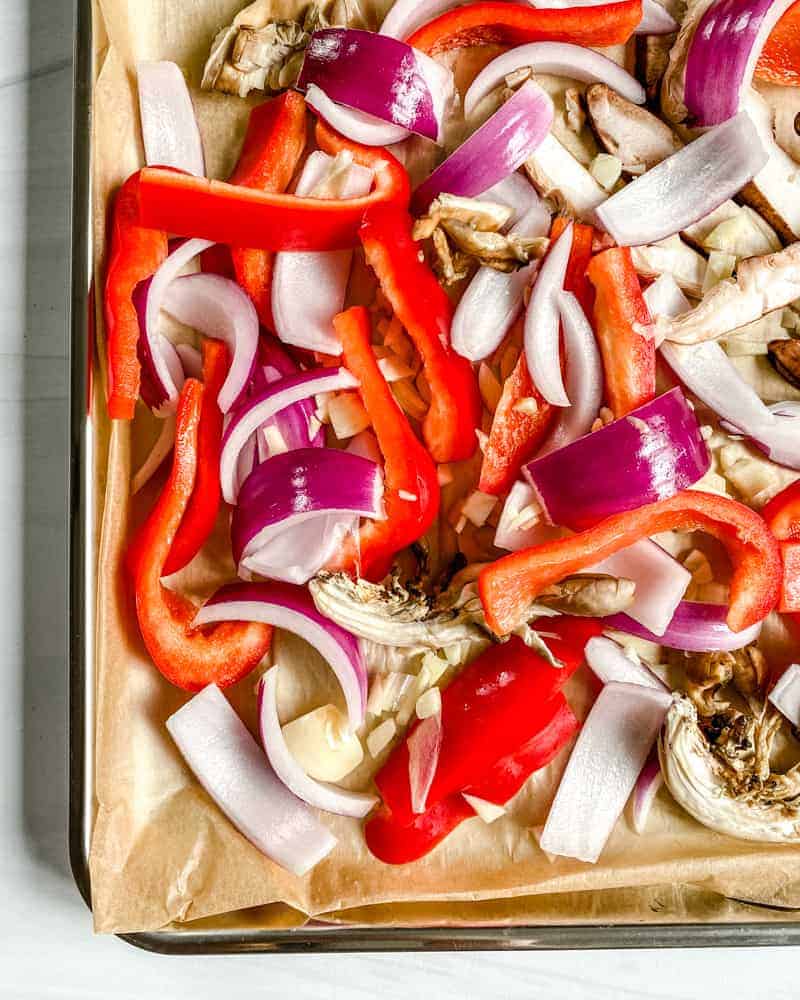 chopped peppers and mushrooms against a white background