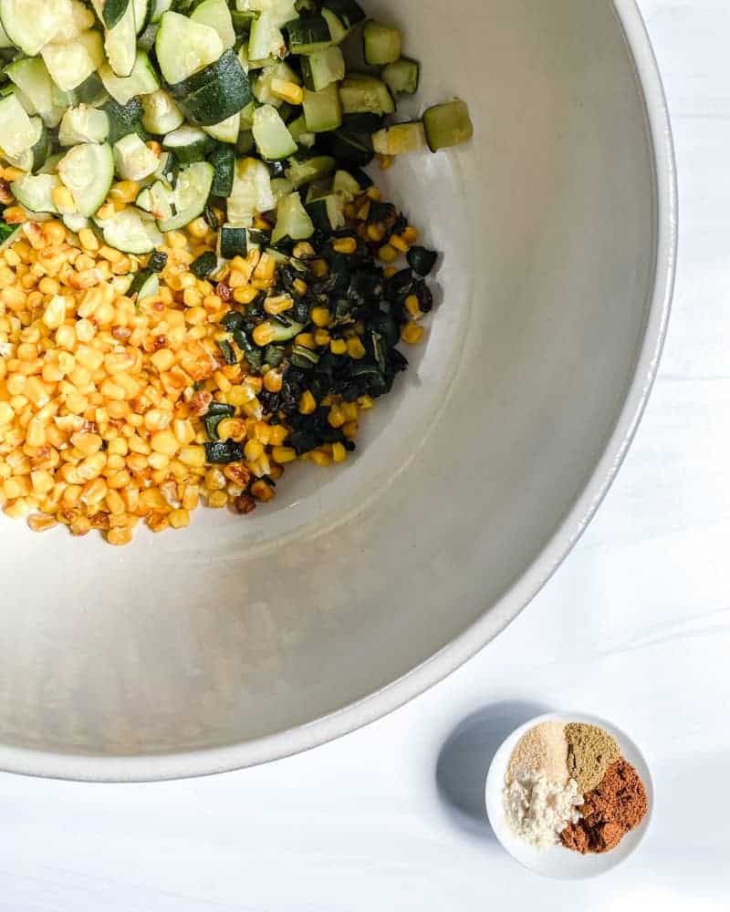 various ingredients in a white bowl against a white background