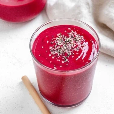 completed Banana Beet Smoothie in a glass cup against a light background