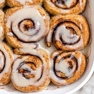 completed These Homemade Vegan Cinnamon Rolls on a white plate