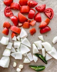 post cutting of vegetables for Homemade Roasted Red Salsa on baking tray