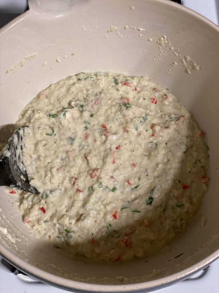 process shot of mixing ingredients together in a bowl