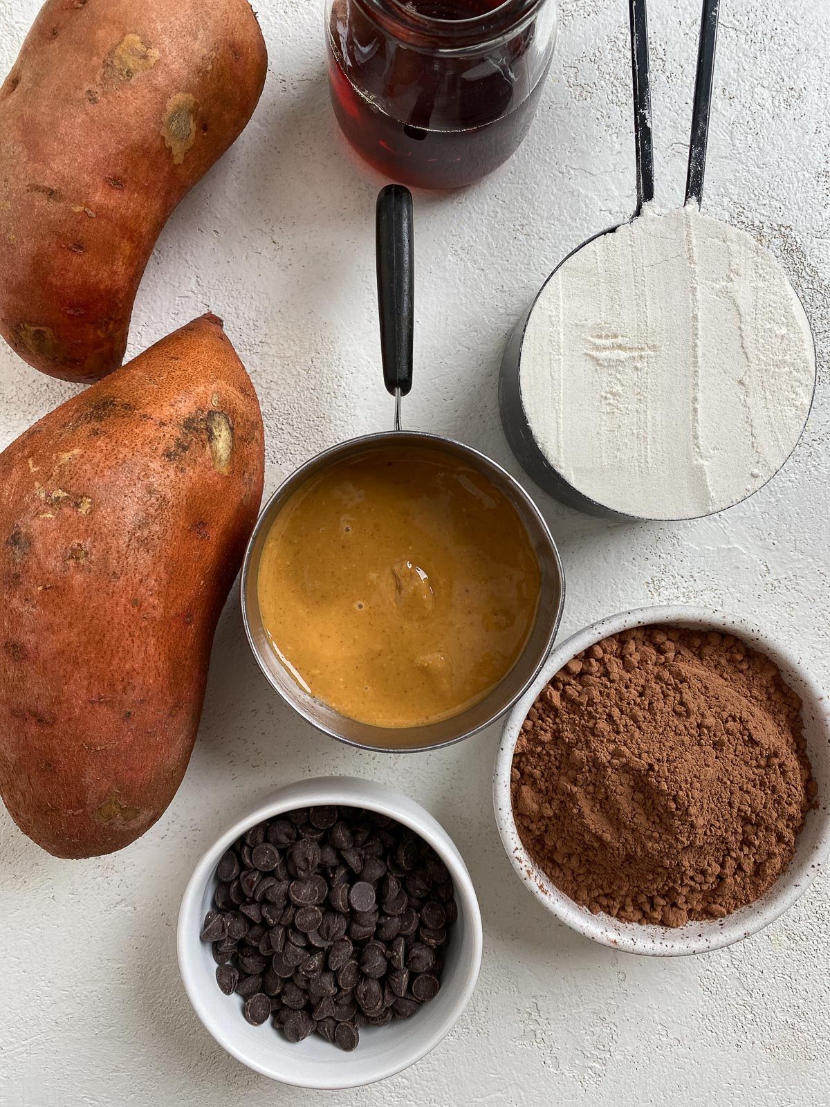 ingredients for Sweet Potato Brownies against a white surface