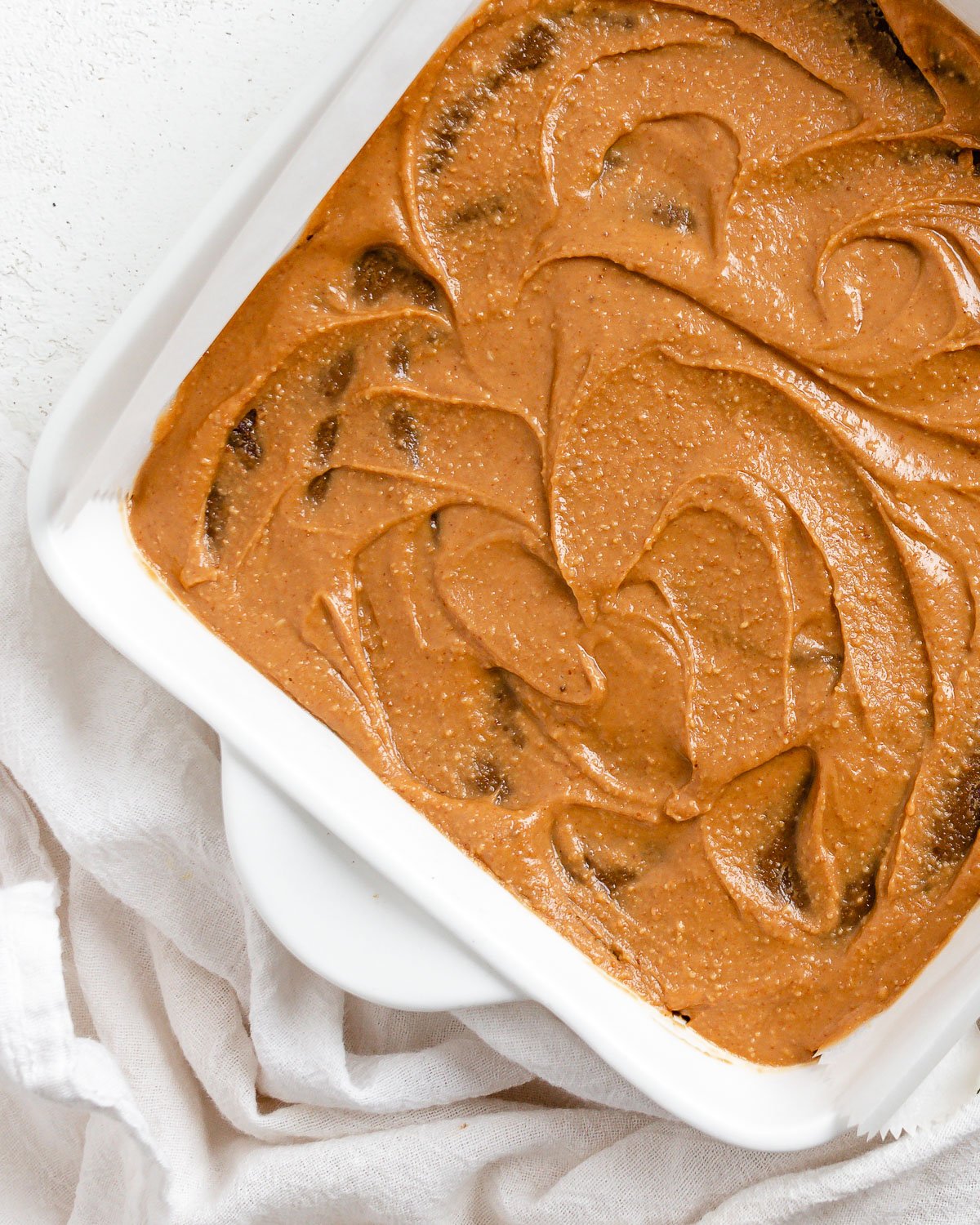 completed Sweet Potato Brownies in baking tray against white surface