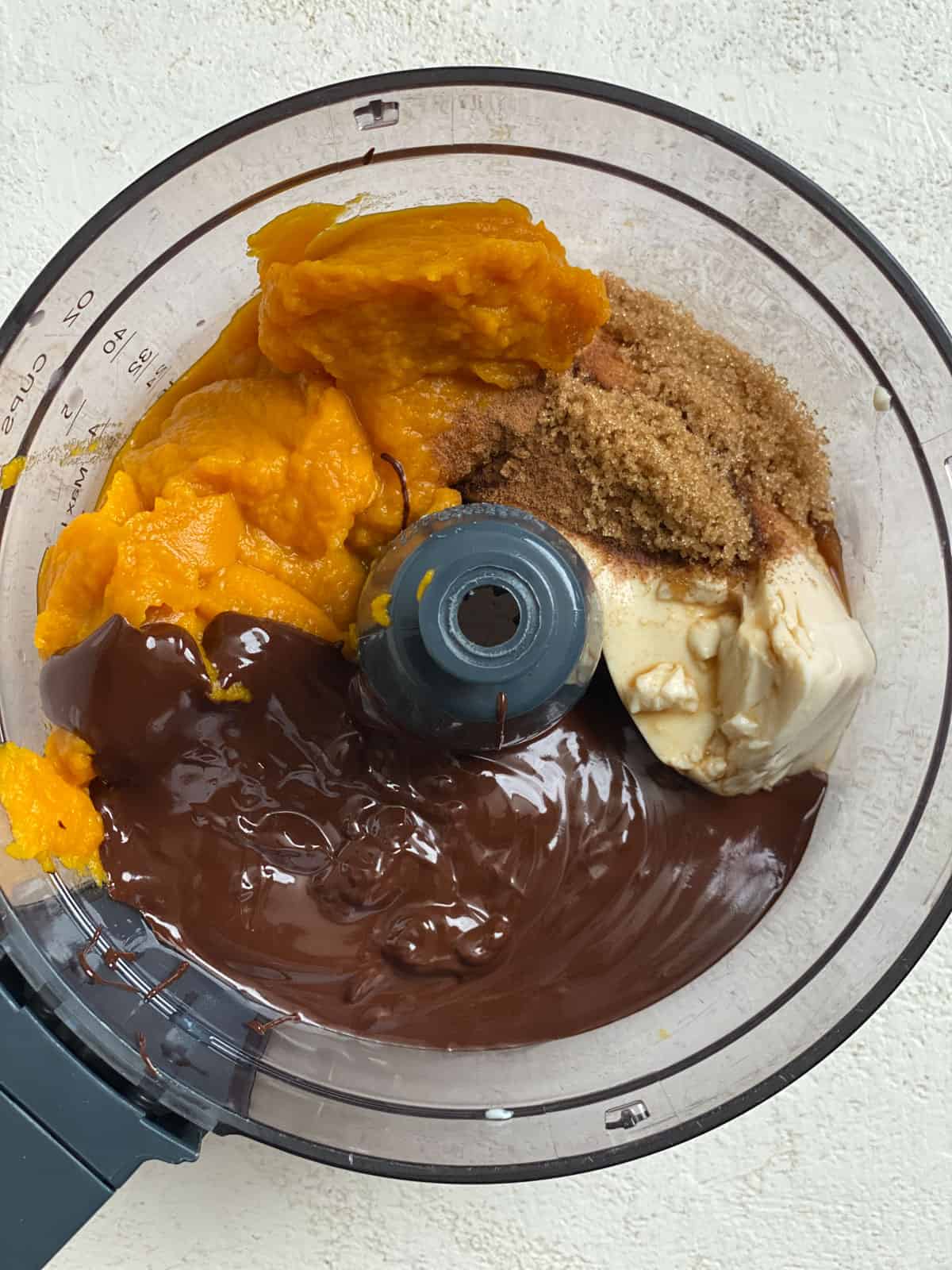 addition of ingredients for Chocolate Pumpkin Pie in blender