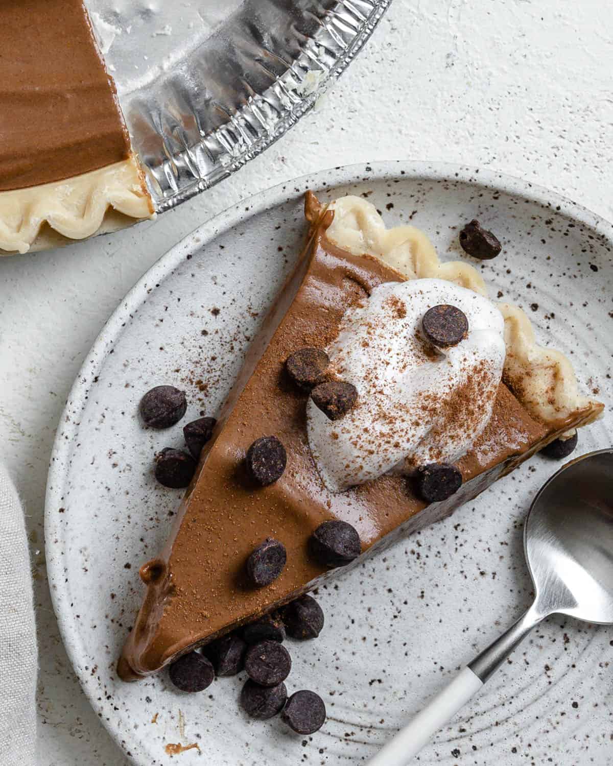 completed slice of Chocolate Pumpkin Pie plated on a white plate