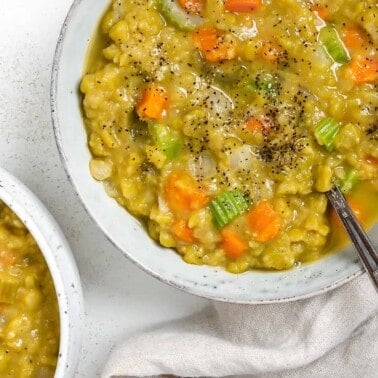 completed Vegan Split Pea Soup in a white bowl against a white surface