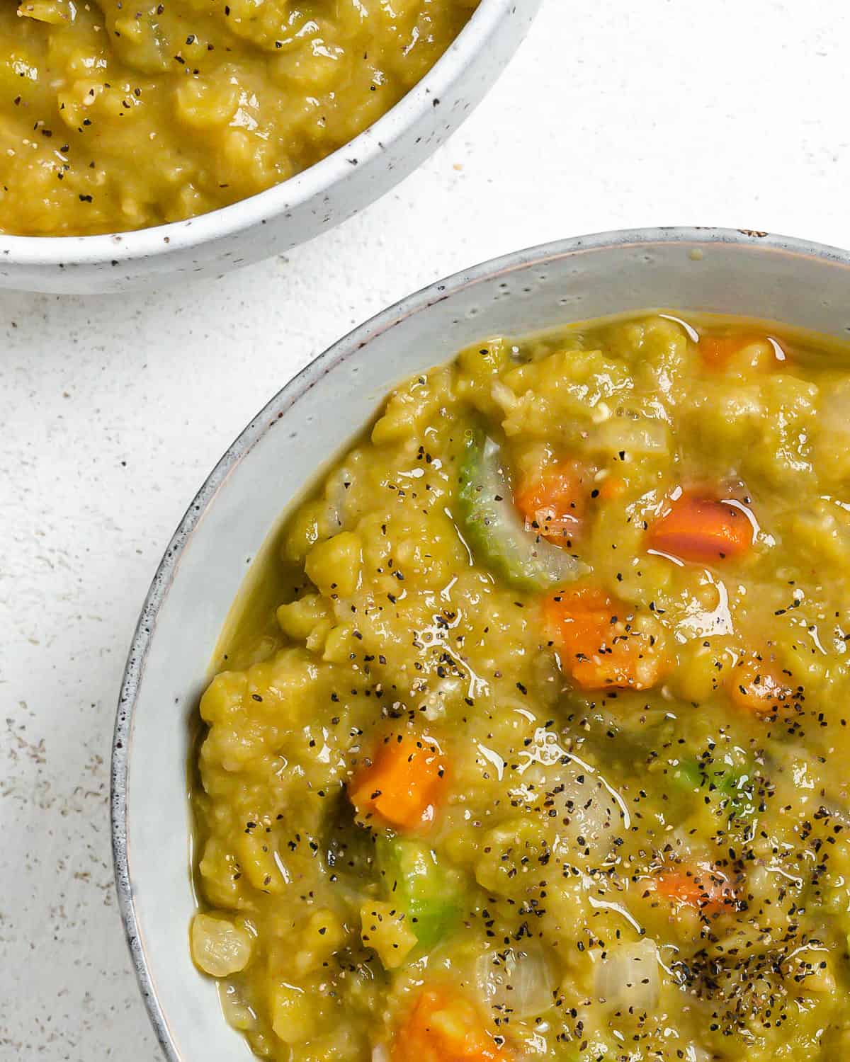 completed Vegan Split Pea Soup in a white bowl against a white surface