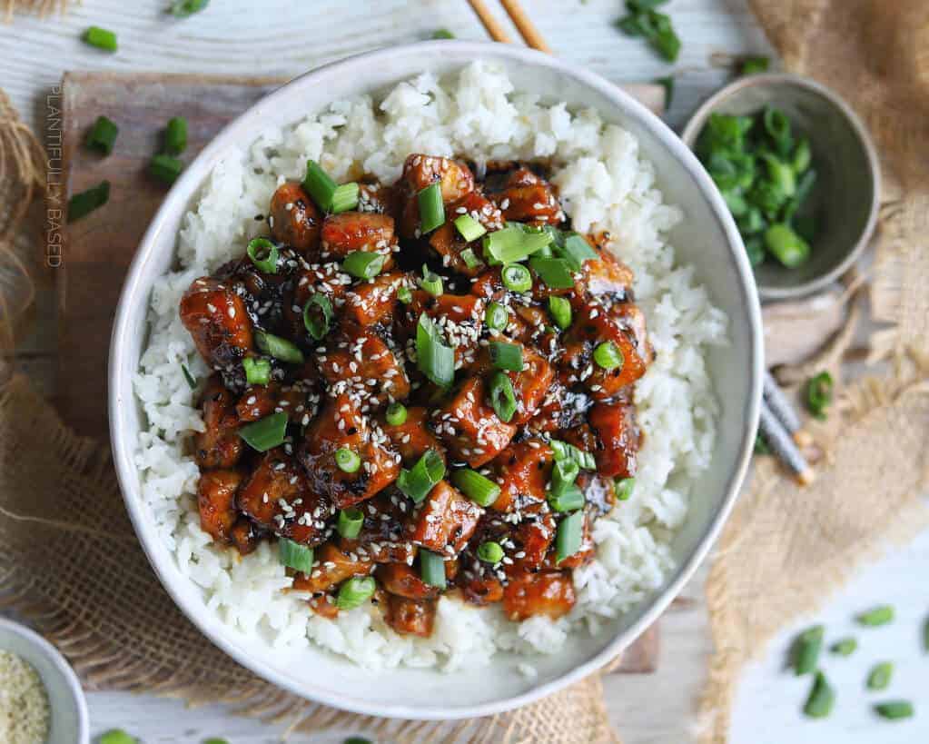 Sesame Tofu Served with White rice on a bowl