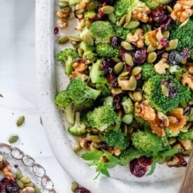 Vegan Broccoli Salad in a white dish against a white background