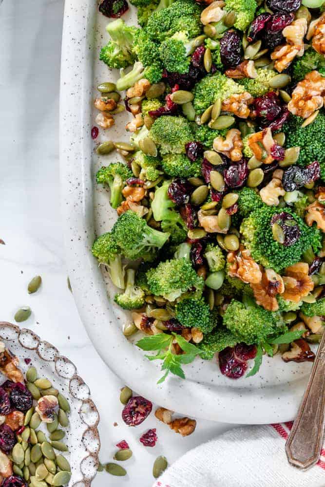 Vegan Broccoli Salad in a white dish against a white background