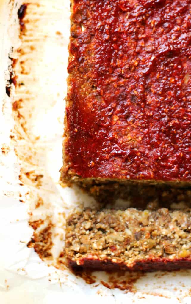 vegan cauliflower loaf for thanksgiving with a slice cut out