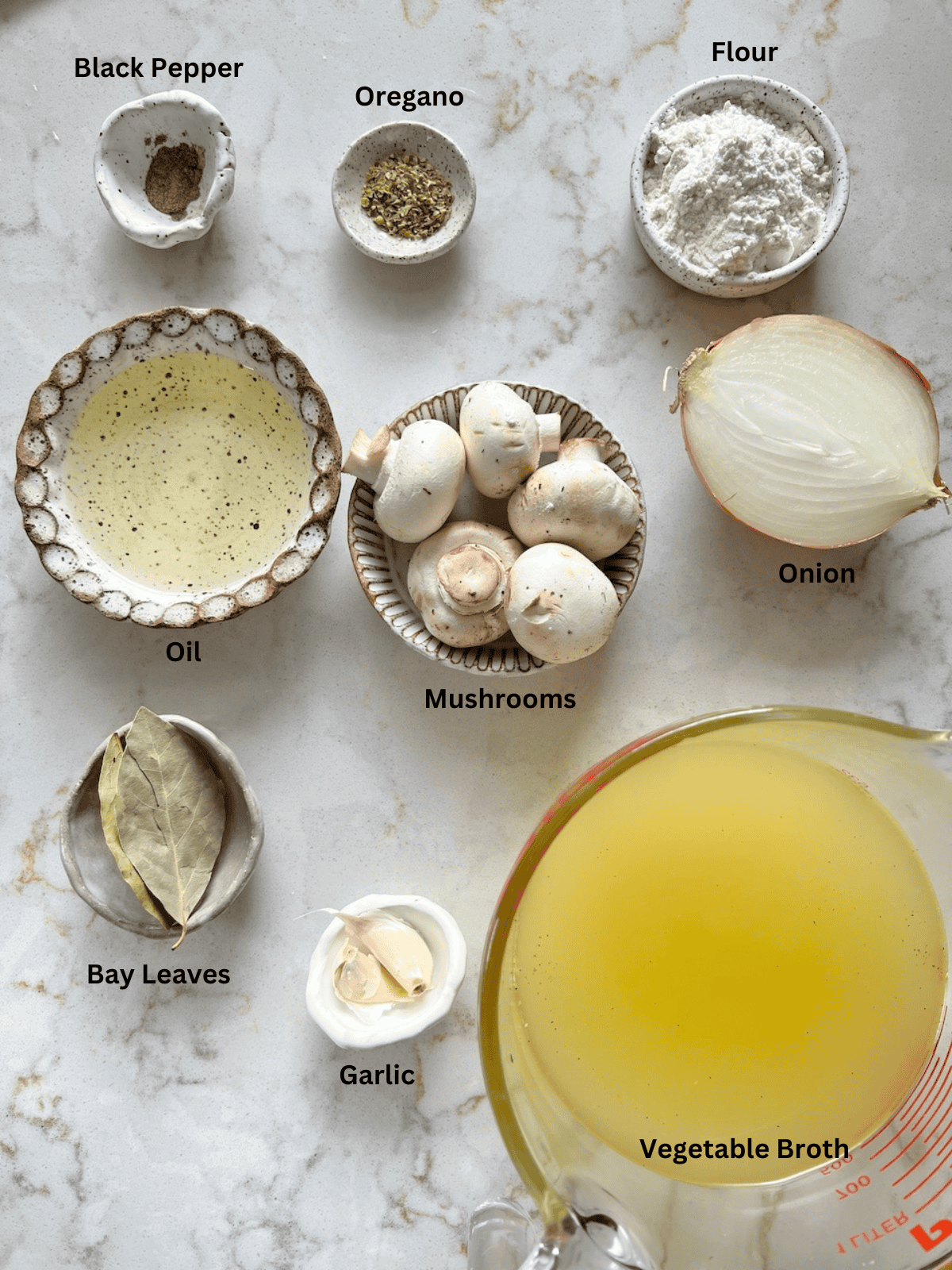 ingredients for Mushroom Gravy measured out on a white surface