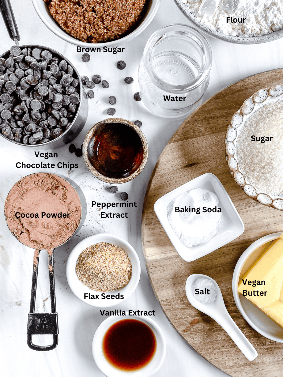 ingredients for Chocolate Peppermint Chocolate Chip Cookies measured out on a white surface