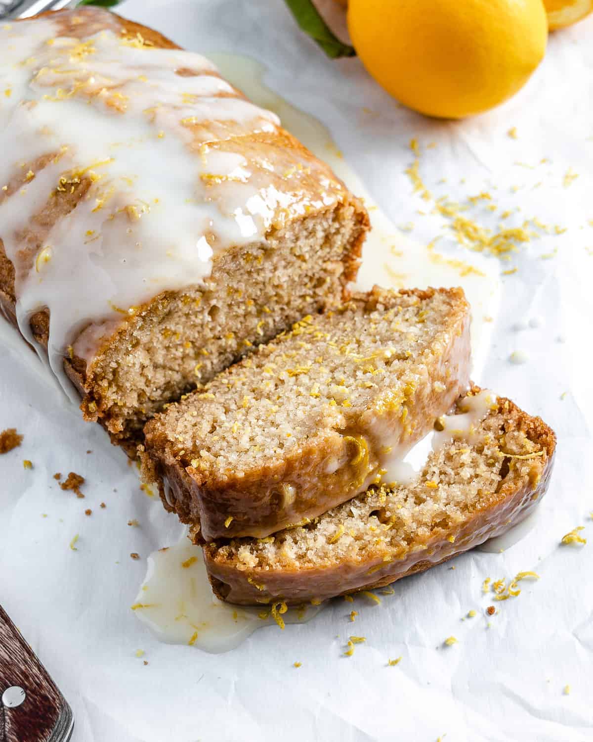 completed sliced lemon loaf against a white background