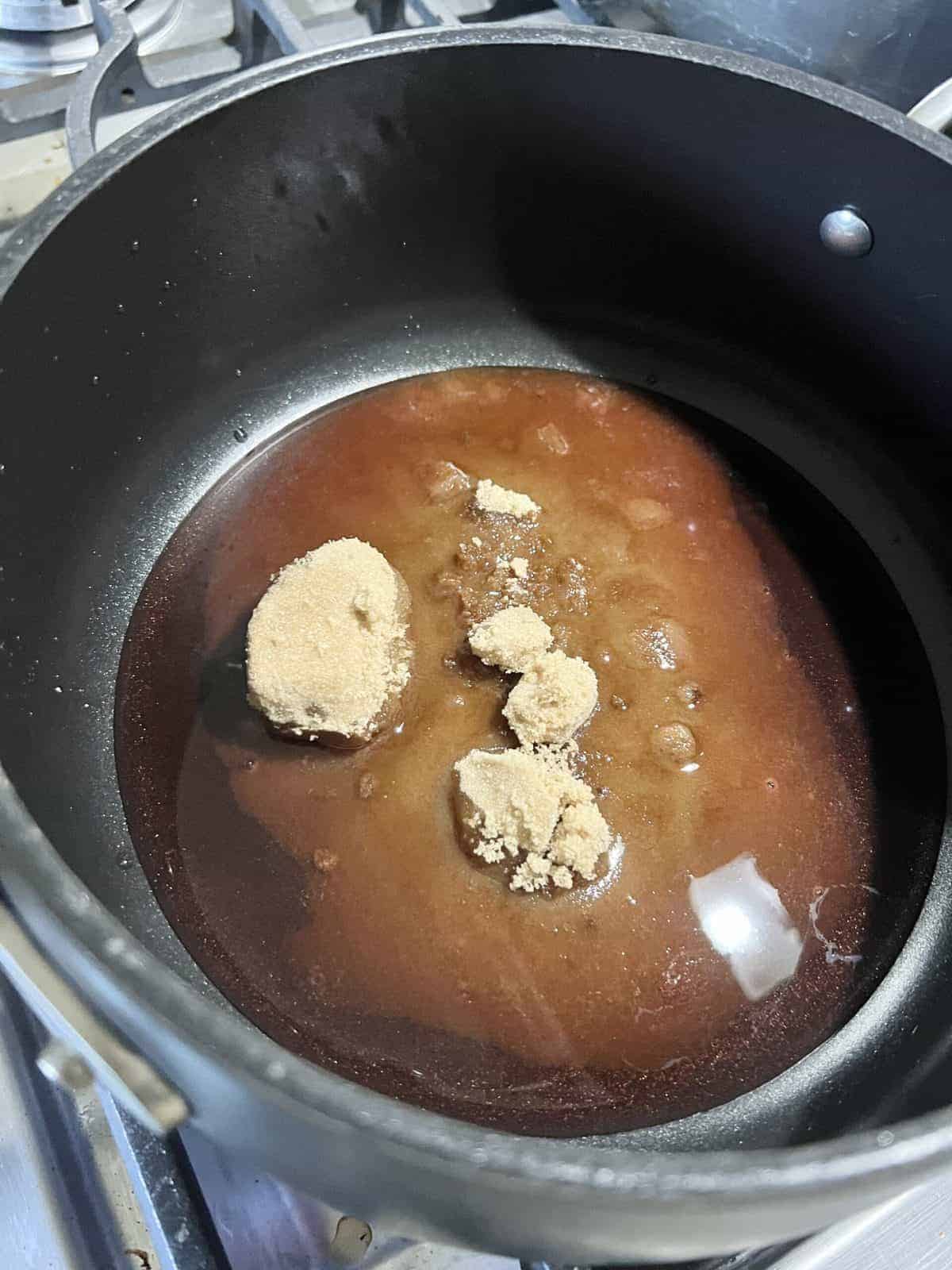 process of adding ingredients to pot for sweet tomato chutney