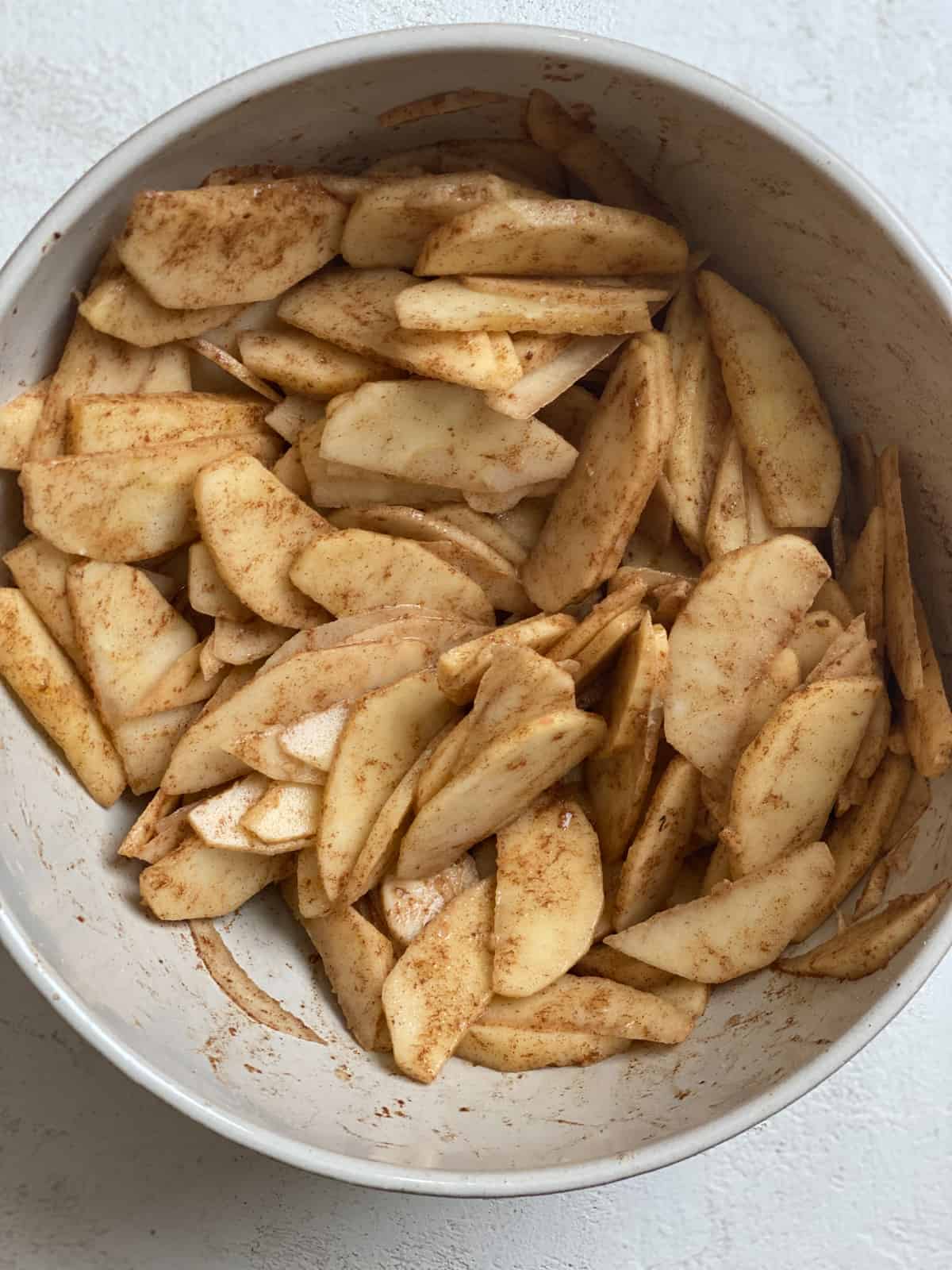 sliced fruits and filling ingredients in a bowl