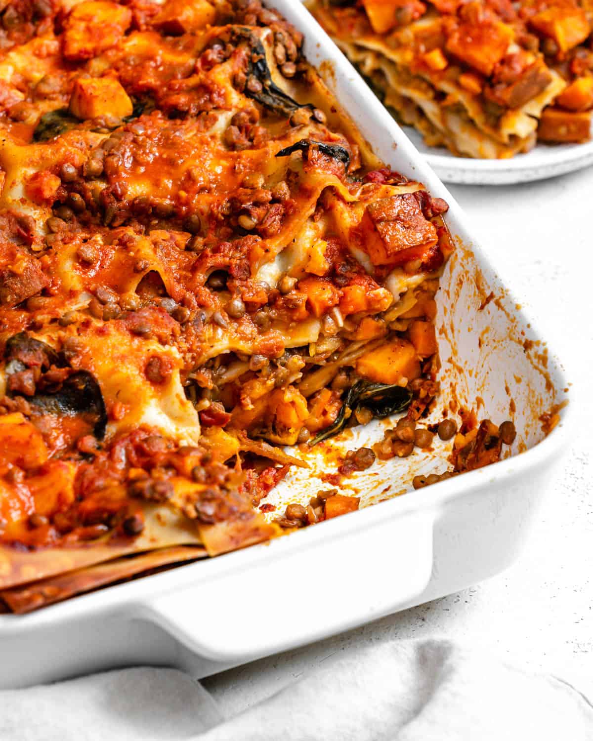 completed Easy Sweet Potato Lasagna in a baking dish against a white surface