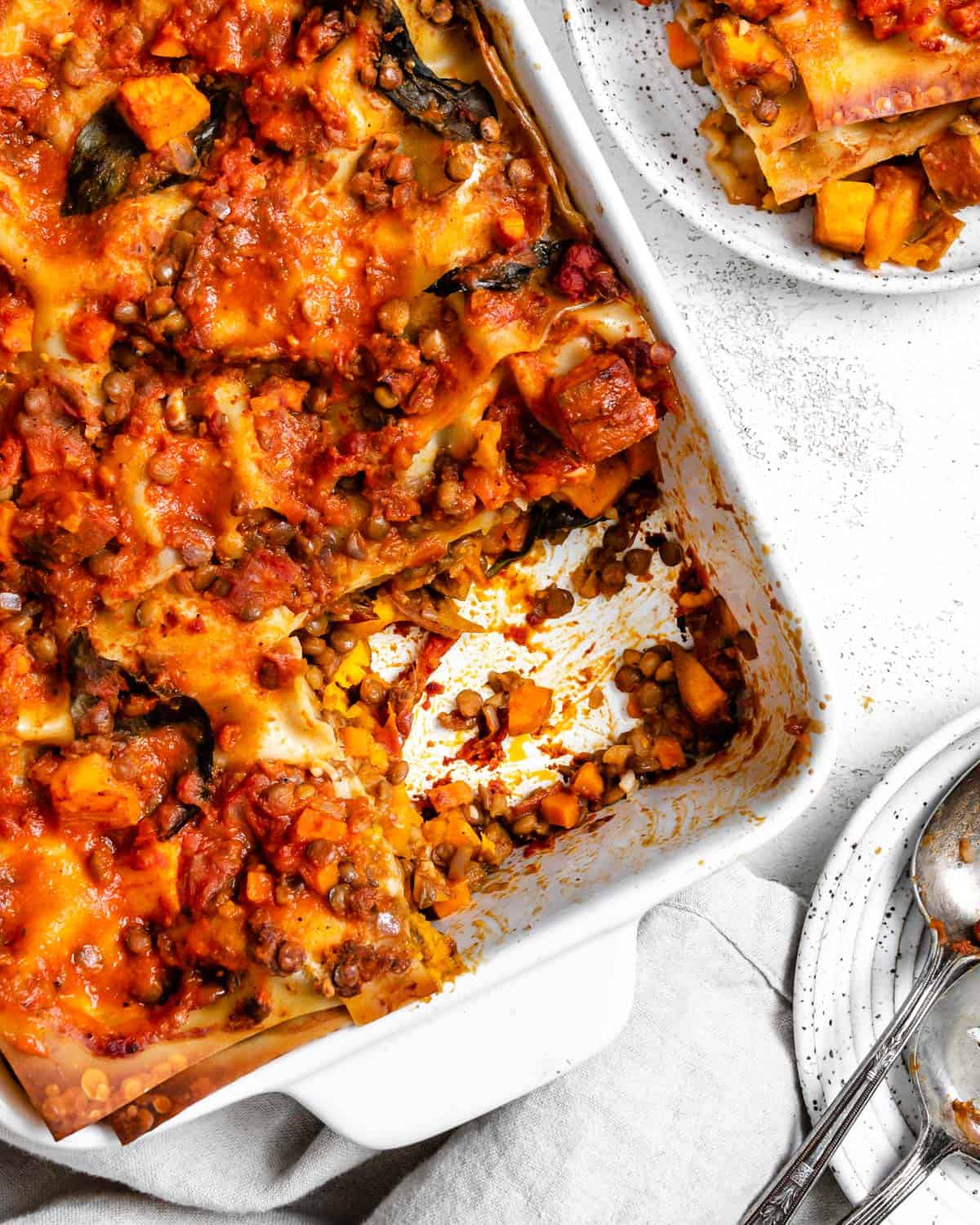 completed Easy Sweet Potato Lasagna in a baking dish against a white surface