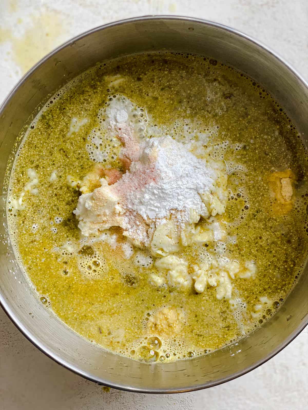 process shot of mixing seasonings into veggie broth mixture