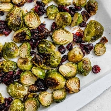 completed Roasted Brussels Sprouts with Cranberries on a white dish