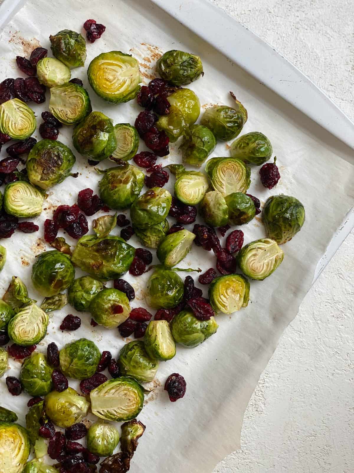 completed Roasted Brussels Sprouts with Cranberries on a white dish