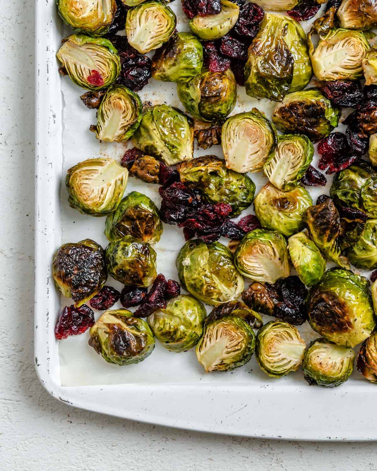 completed Roasted Brussels Sprouts with Cranberries on a white dish