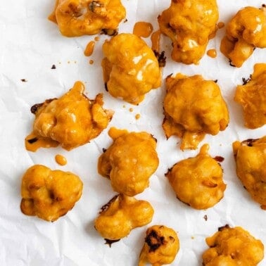 completed Vegan Buffalo Cauliflower Wings [Baked + Air Fried] scattered on a white surface