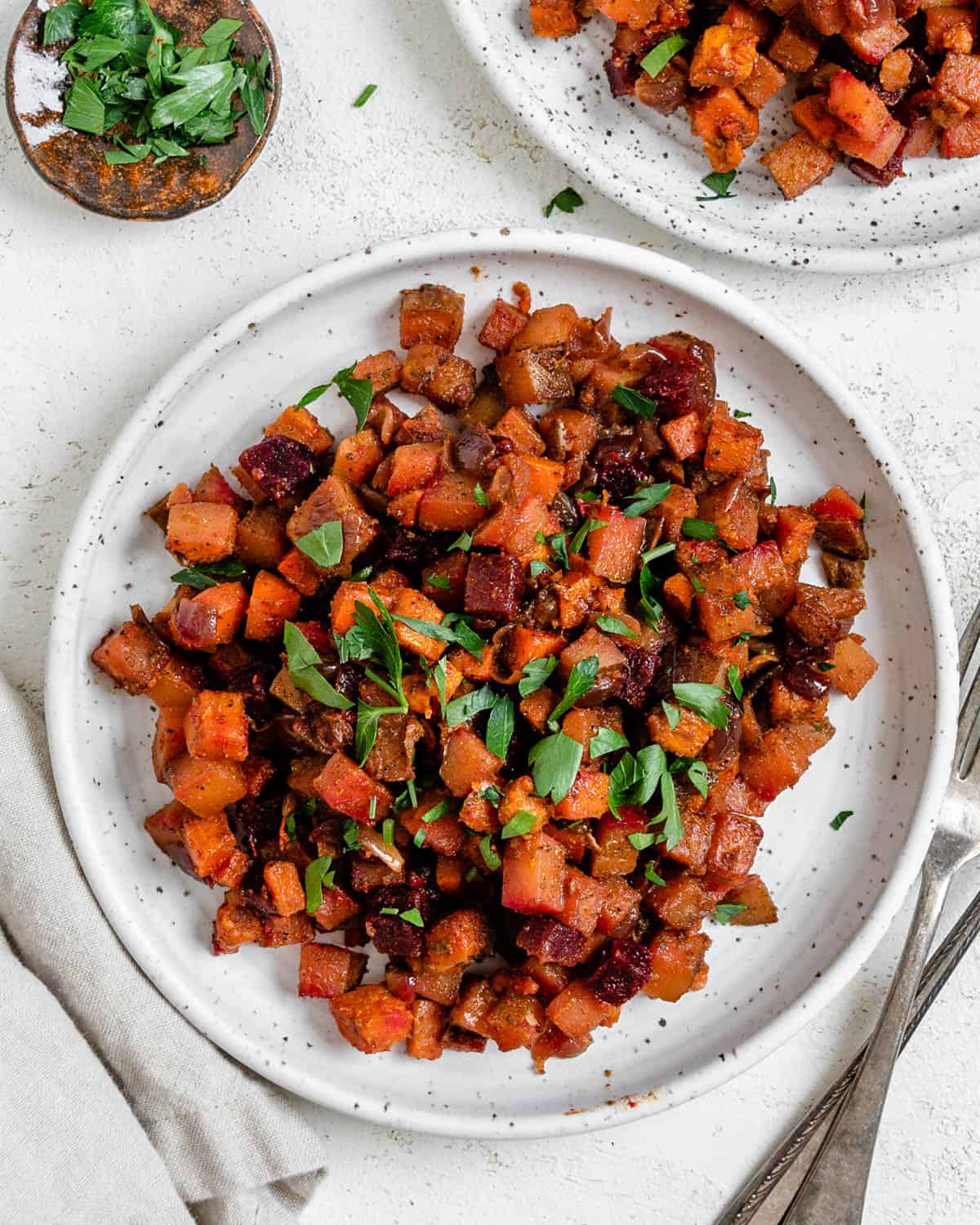 completed One-Pan Root Vegetable Hash plated on a white plate