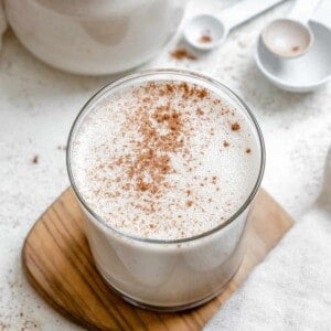 completed Easy Vegan Eggnog on a brown and white surface