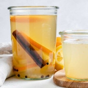 completed Lemon Cinnamon Ginger Tea in two separate glasses against a light background