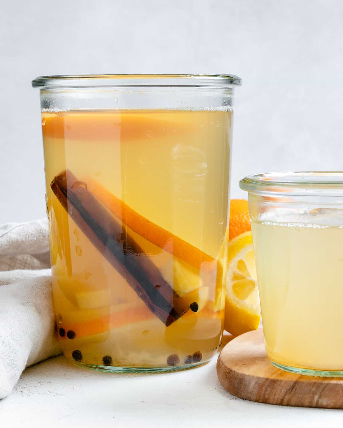 completed Lemon Cinnamon Ginger Tea in two separate glasses against a light background