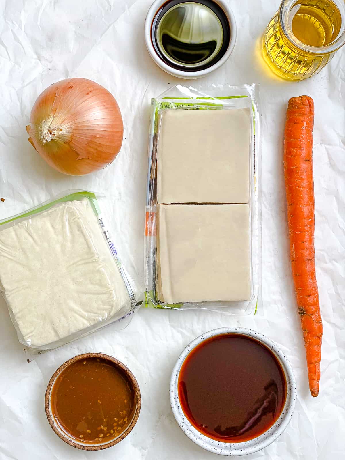 ingredients for Tofu Vegetable Crispy Wontons measured out against a white surface