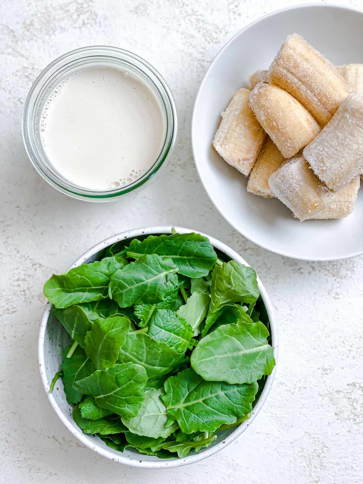 ingredients for Banana Kale Smoothie measured out against a white background