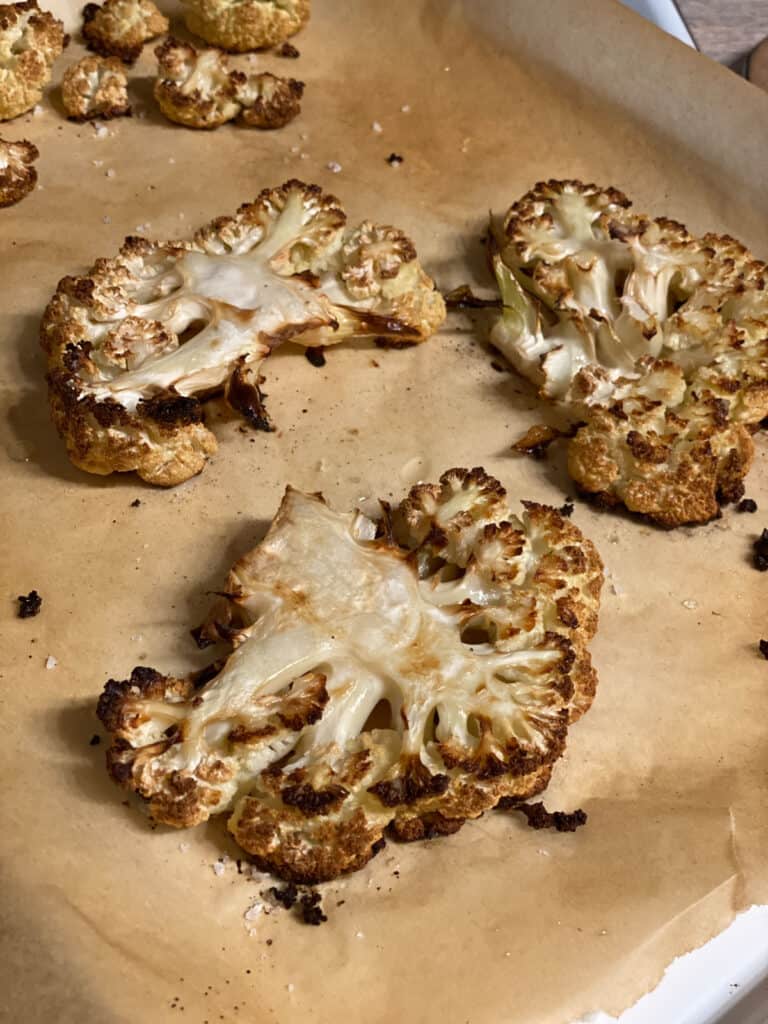 process shot of cauliflower steaks post being roasted