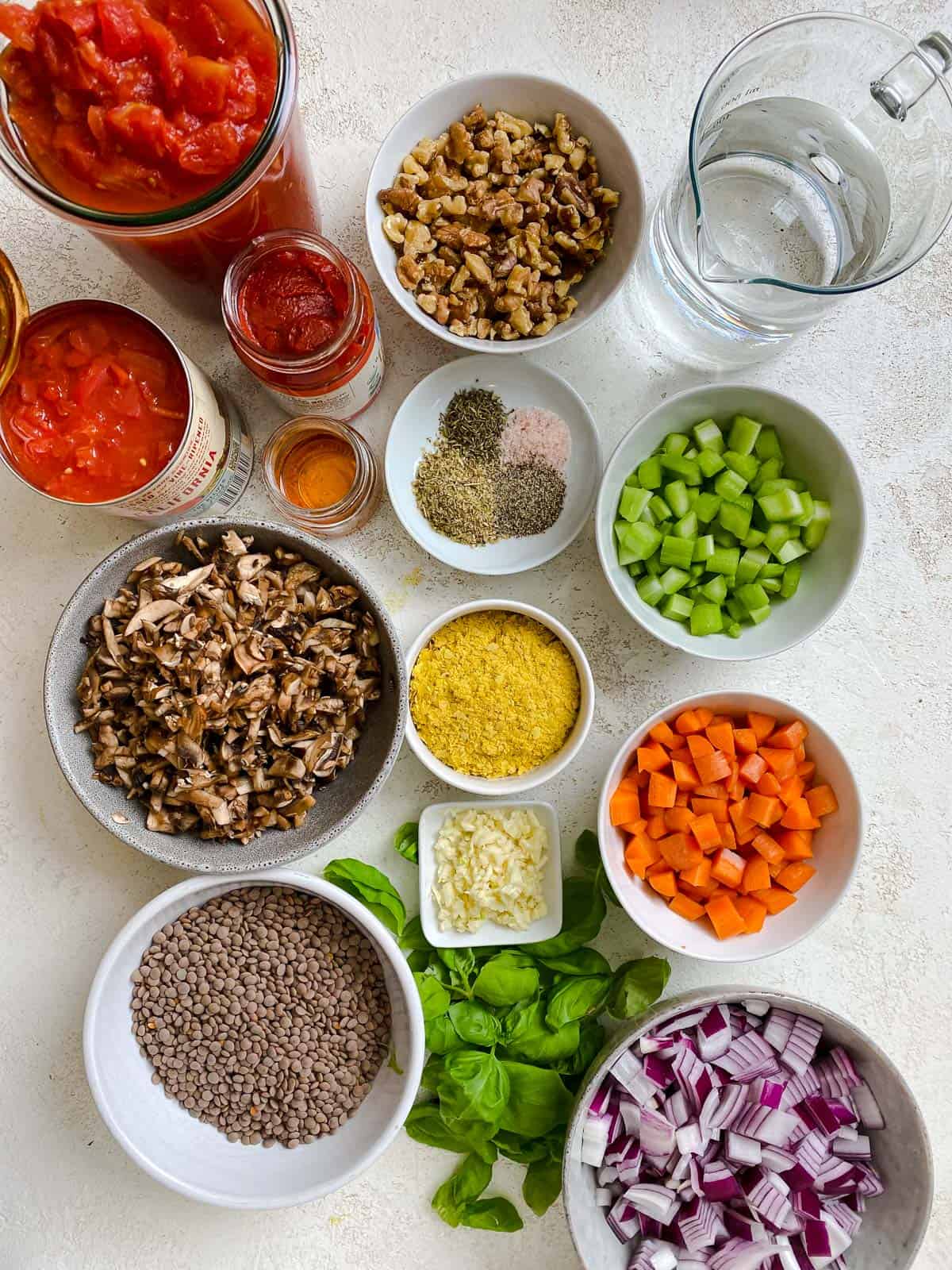 ingredients for Vegan Lentil Bolognese measured out against a white background