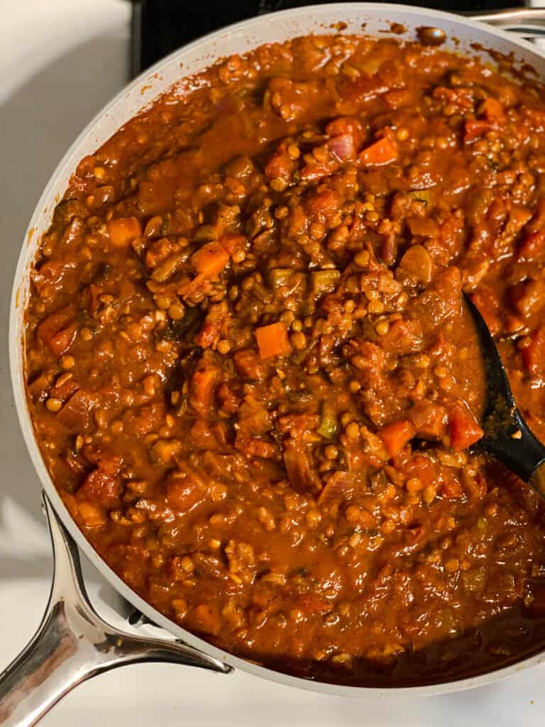 process shot of mixing ingredients together in pan