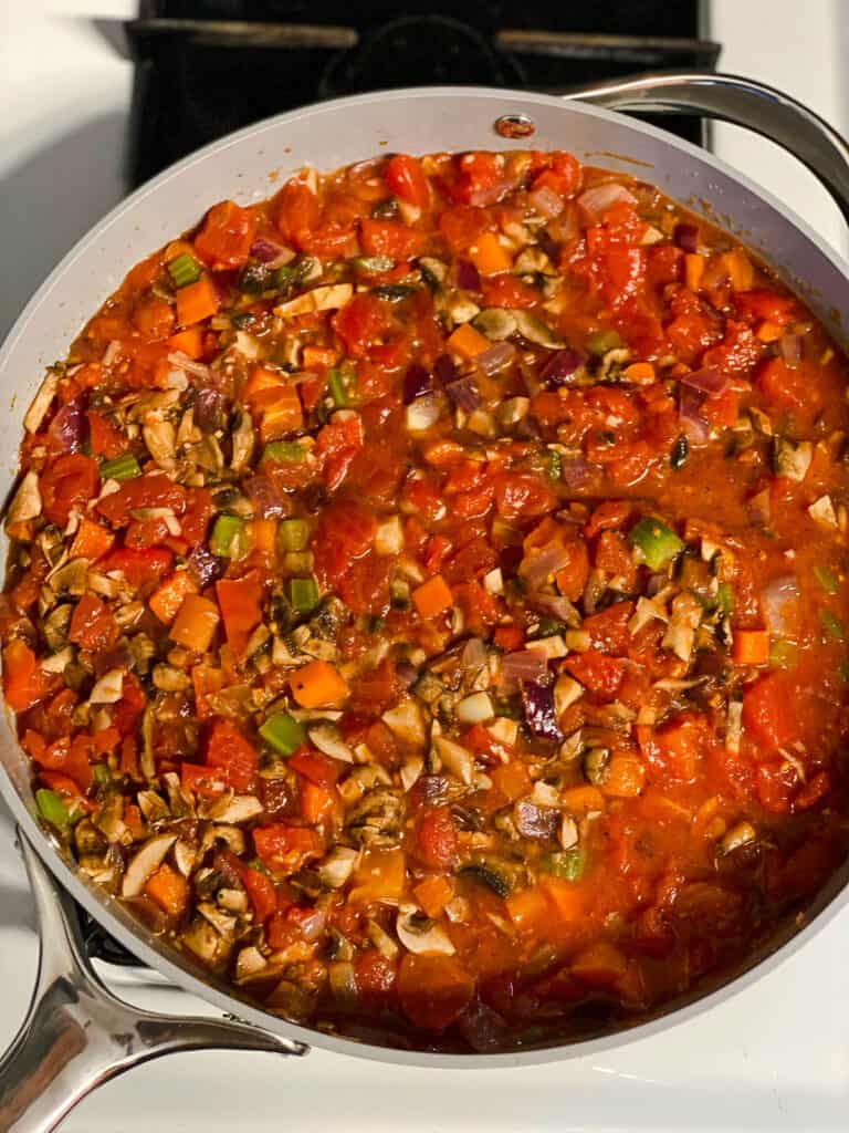 process shot of mixing ingredients together in a pan