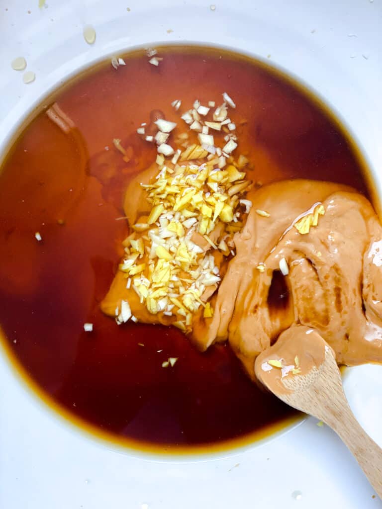 process shot of mixing ingredients together in a bowl