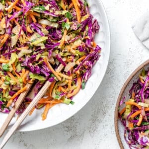 completed Crunchy Thai Peanut Salad in a white bowl against a white background