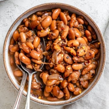 completed Frijoles de la Olla in a bowl against a white background