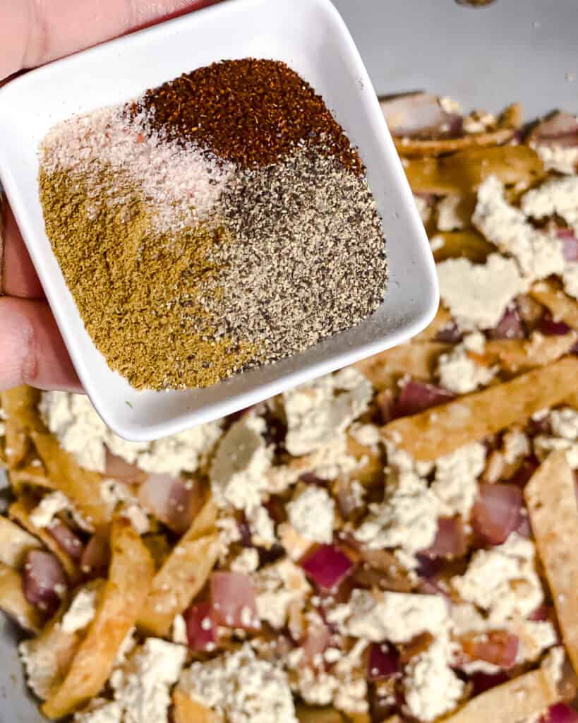 process shot of adding spices to pan